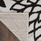 Nourison Home Aloha 114" x 156" Fabric Indoor/Outdoor Rug in Black/White Finish