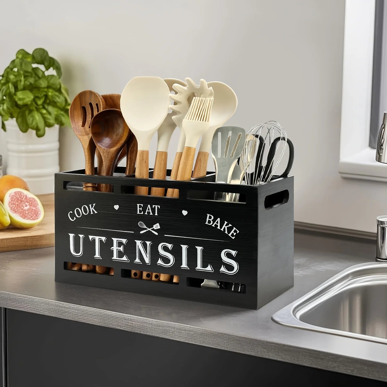 Wooden kitchen utensil rack, countertop utensil organizer with 3 compartments, rustic decor and cooking tool storage.