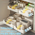 Kitchen storage rack with sliding rails, pull-out drawer-style storage tray, cabinet organizer